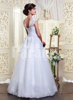 Women’s princess style rich white satin floor length wedding gown with tulle skirt underneath back side view