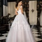 Women’s princess style super gorgeous flared wedding tulle gown in pearl white back side view