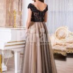 Women’s rich black lace royal bodice evening gown with soft and sleek tulle skirt back side view