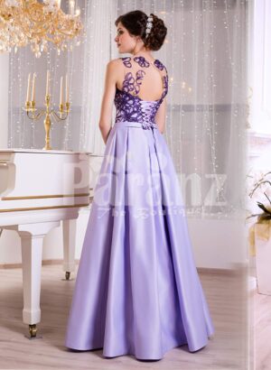 Women’s rich satin evening gown with long skirt and stylish satin-sheer bodice side view