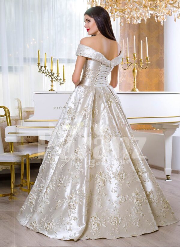 Women’s rich satin flared and floor length silver satin gown with all over floral appliqués back side view