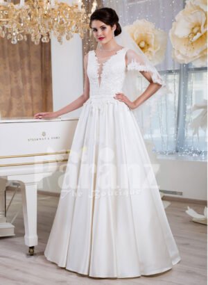 Women’s rich satin floor length white wedding gown with tulle skirt underneath