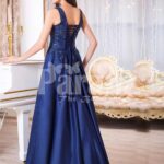 Women’s rich satin long evening gown with glitz royal sleeveless bodice in navy back side view