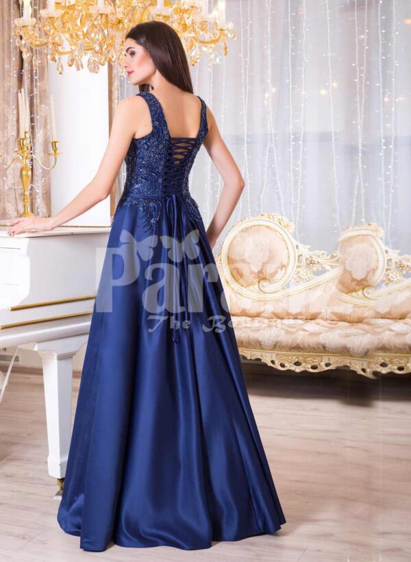 Women’s rich satin long evening gown with glitz royal sleeveless bodice in navy back side view