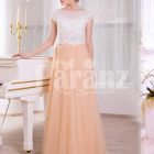 Women’s rich white rhinestone work bodice elegant evening gown with peach tulle skirt