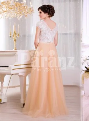 Women’s rich white rhinestone work bodice elegant evening gown with peach tulle skirt back side view