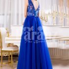 Women’s royal blue elegant evening gown with long tulle skirt and lacy bodice back side view