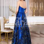 Women’s royal blue off-shoulder evening gown with floral appliquéd long skirt back side view