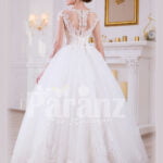 Women’s simple and elegant pearl white floor length tulle skirt wedding gown with lace designs back side view