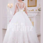 Women’s simple and elegant pearl white floor length tulle skirt wedding gown with lace designs back side view