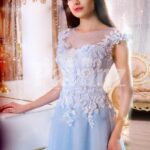 Women’s sky blue floor length evening gown with tulle skirt and floral bodice close view