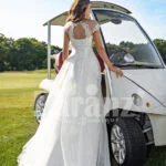 Women’s sleeveless elegant white flared high volume tulle wedding gown Back side view