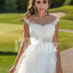 Women’s sleeveless elegant white flared high volume tulle wedding gown close view