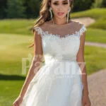 Women’s sleeveless elegant white flared high volume tulle wedding gown close view