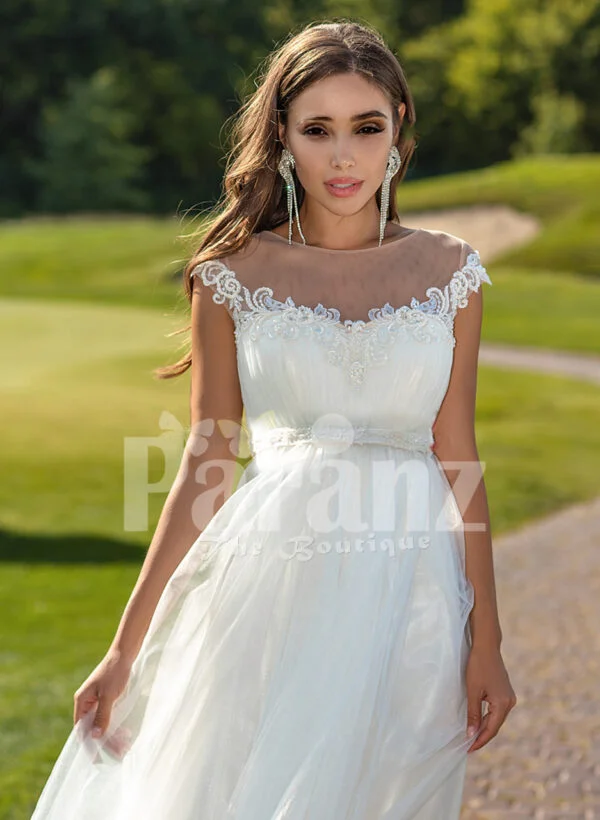 Women’s sleeveless elegant white flared high volume tulle wedding gown close view