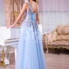 Women’s sleeveless evening gown with floor length tulle skirt and flower appliquéd bodice back side view