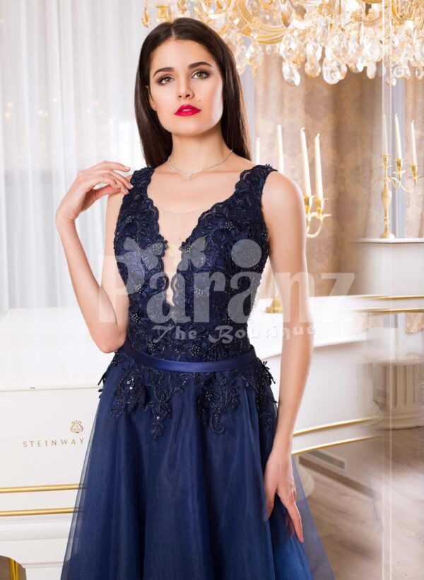Women’s sleeveless navy floor length gown with rich rhinestone studded bodice