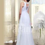 Women’s sleeveless pearl white floor length satin gown with glitz waist belt back side view