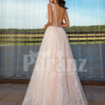 Women’s sleeveless power pink glitz glam tulle wedding gown back side view