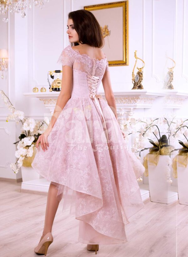 Women’s soft and light pink high low satin evening gown with elegant lace work all over back side view
