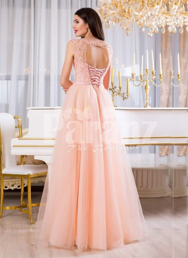 Women’s soft peach long tulle skirt evening gown with threaded appliquéd bodice back side view