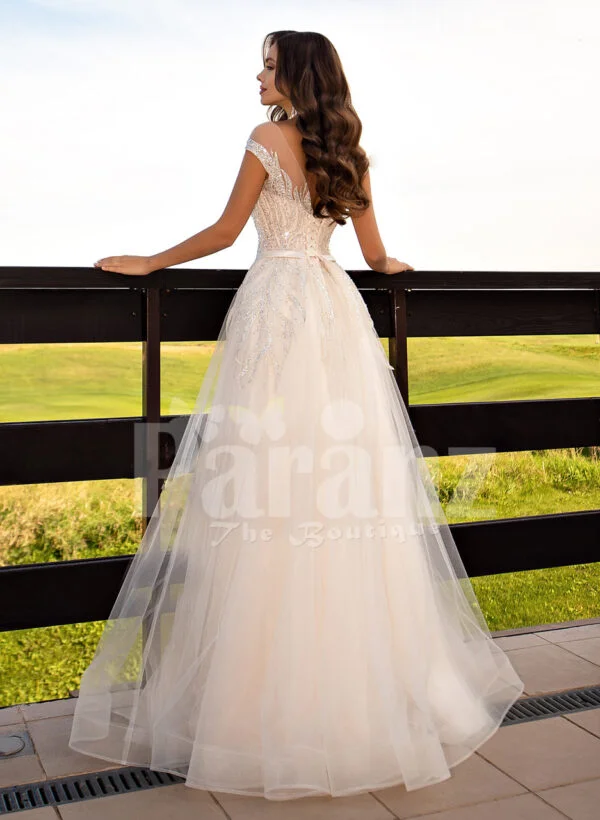 Women’s stunning all white tulle wedding gown with royal bodice back side view