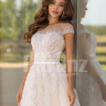 Women’s stunning all white tulle wedding gown with royal bodice close view