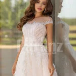 Women’s stunning all white tulle wedding gown with royal bodice close view