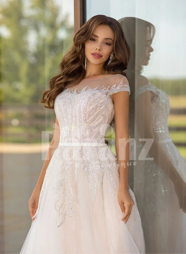 Women’s stunning all white tulle wedding gown with royal bodice close view