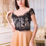 Women’s stunning evening gown with lacy black bodice and long peach tulle skirt