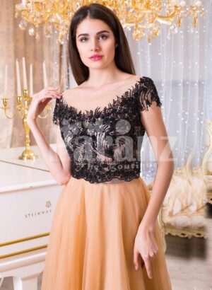 Women’s stunning evening gown with lacy black bodice and long peach tulle skirt