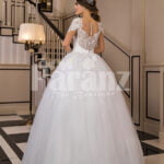 Women’s super glam exclusive flared and high volume wedding tulle gown in white back side view