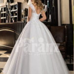Women’s super stylish and elegant white wedding tulle gown with lacy bodice back side view
