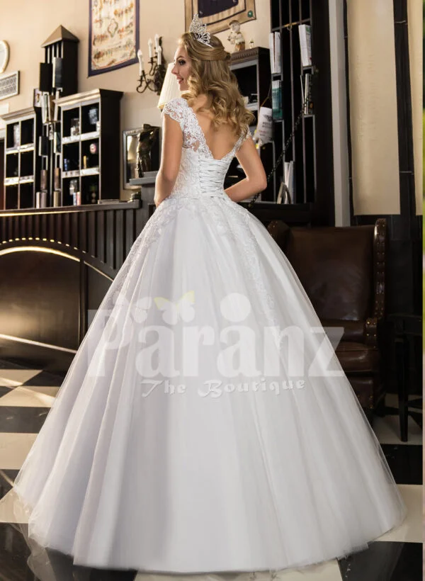 Women’s super stylish and elegant white wedding tulle gown with lacy bodice back side view