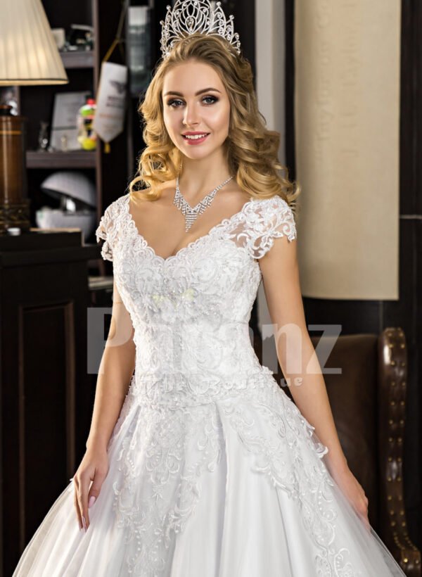 Women’s super stylish and elegant white wedding tulle gown with lacy bodice close view