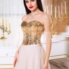 Women’s super stylish golden sequin bodice evening gown with long pink tulle skirt