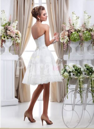 Women’s tea length pearl white wedding tulle gown with off-shoulder bodice side view