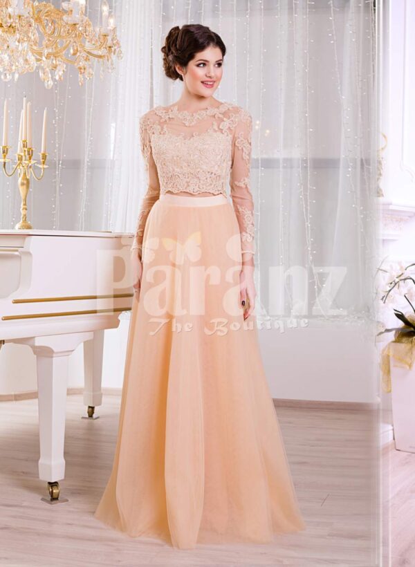 Women’s truly glam evening gown with long peachy orange tulle skirt and satin bodice