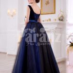 Women’s velvet bodice glam evening gown with flared and high volume satin-tulle skirt back side view