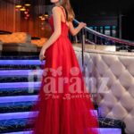 Women’s vibrant red floor length tulle frill evening gown with stylish sleeveless bodice back side view