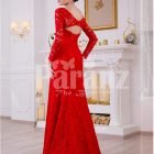 Women’s vibrant red side slit full sleeve glam evening gown with all over lace work back side view