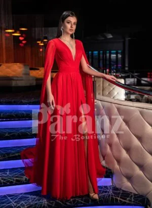 Women’s vibrant red side slit tulle skirt gown with long frilly sleeves