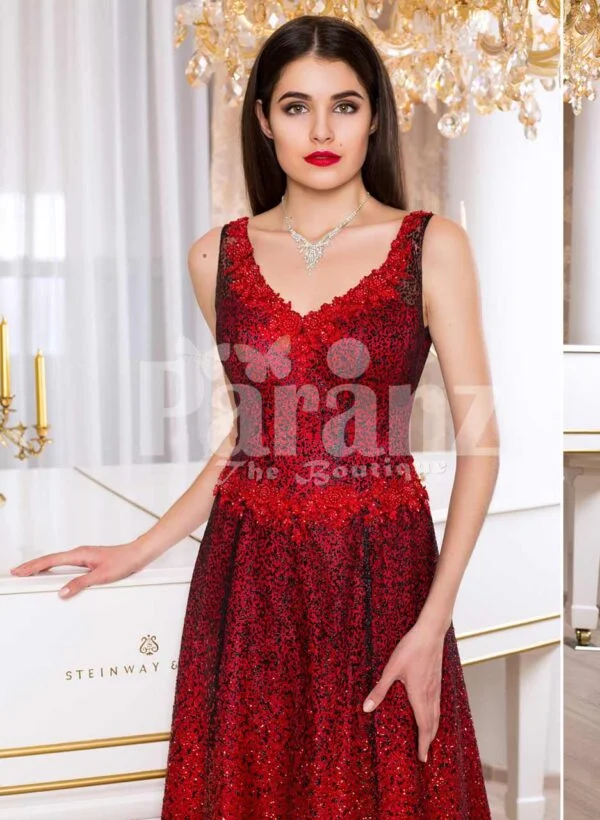 Women’s vibrant red sleeveless evening gown with floor length skirt