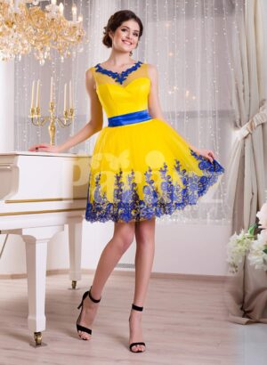Bright yellow small evening gown with short tulle skirt and rich blue lace work