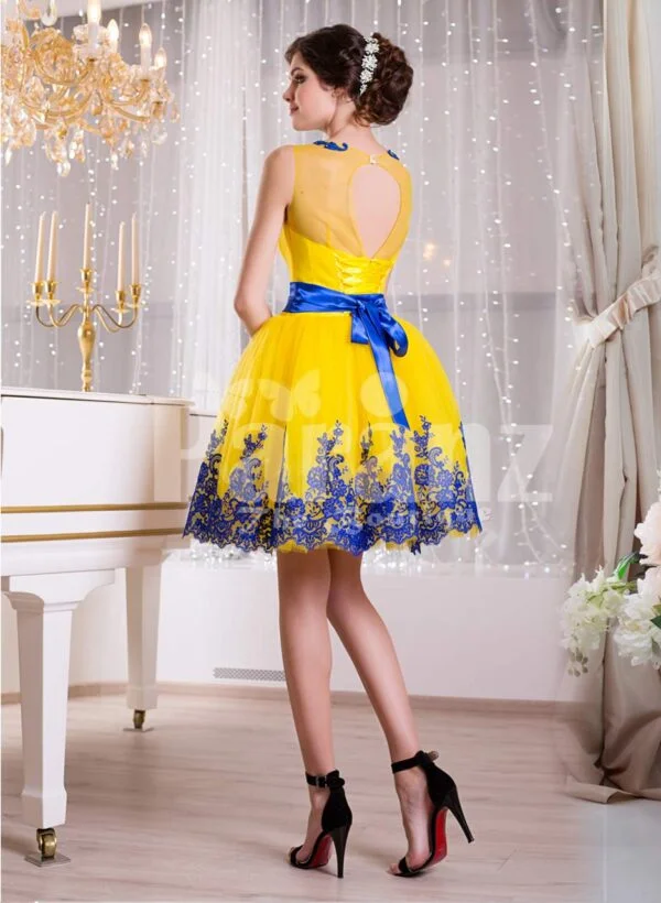 Bright yellow small evening gown with short tulle skirt and rich blue lace work back side view