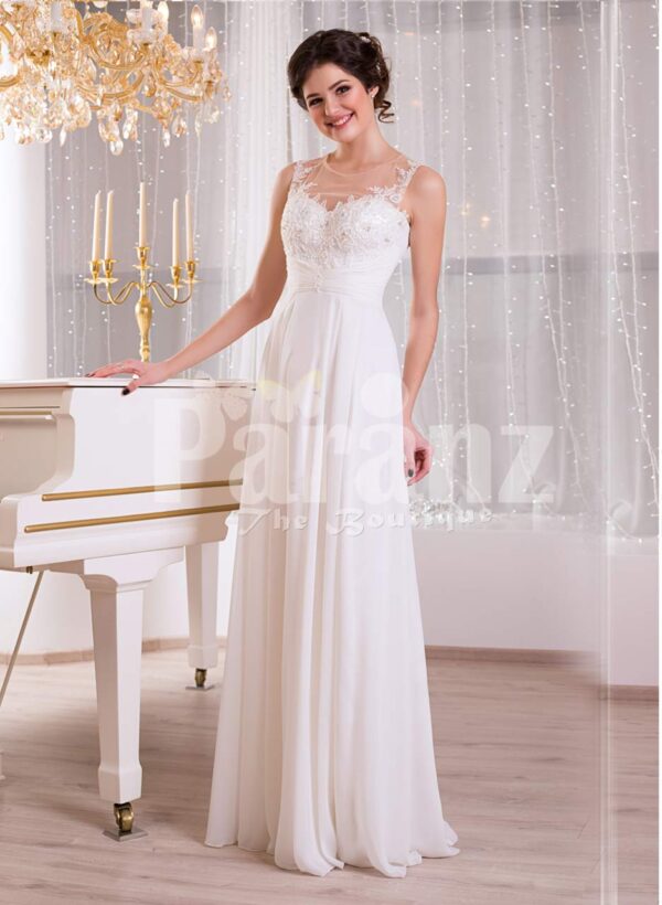Elegant pearl white sleeveless evening gown with long tulle skirt and lace appliquéd bodice