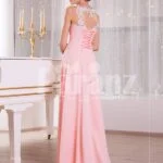 Women’s baby pink glam evening gown with lace appliquéd royal bodice and long tulle skirt back side view