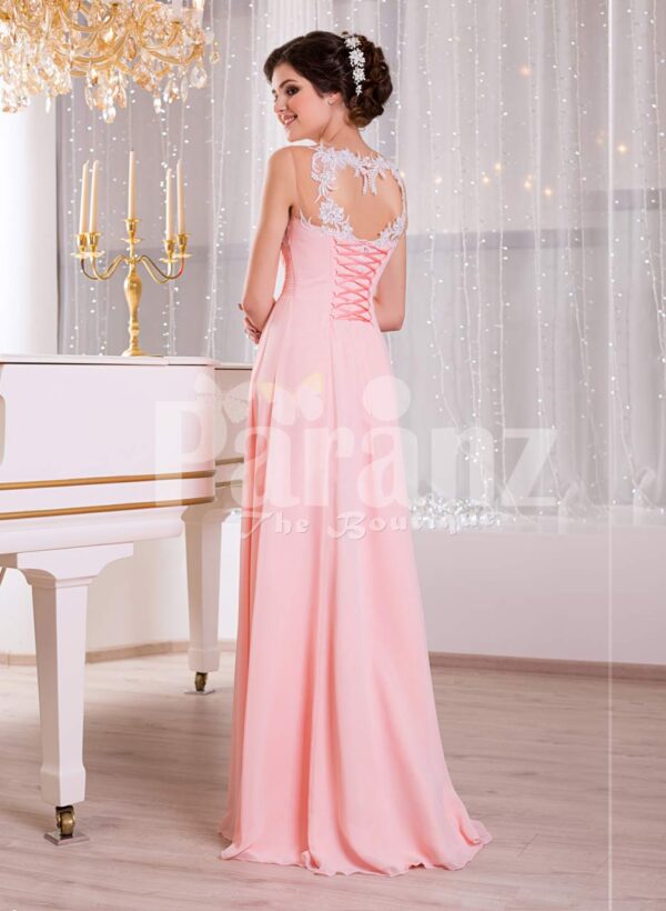 Women’s baby pink glam evening gown with lace appliquéd royal bodice and long tulle skirt back side view