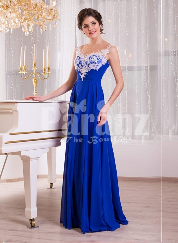 Women’s blue floor length sleek tulle skirt evening gown with white floral appliquéd bodice