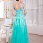 Women’s floor length elegant evening gown with mint tulle skirt and floral appliquéd bodice back side view
